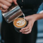 Barista making a latte.