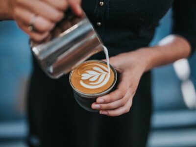 Barista making a latte.